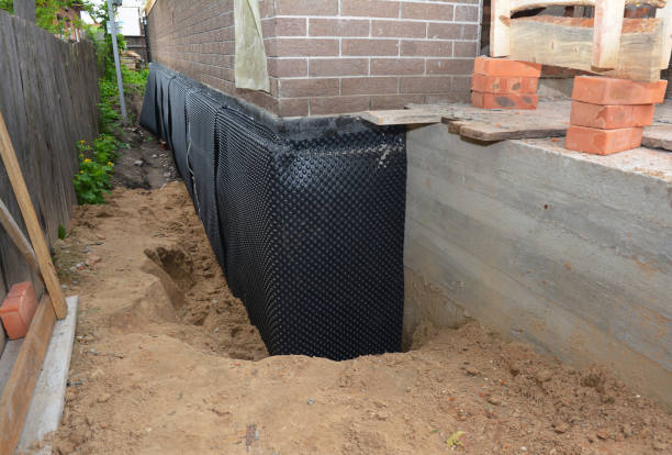 Happy homeowners after waterproofing job in East Bethany